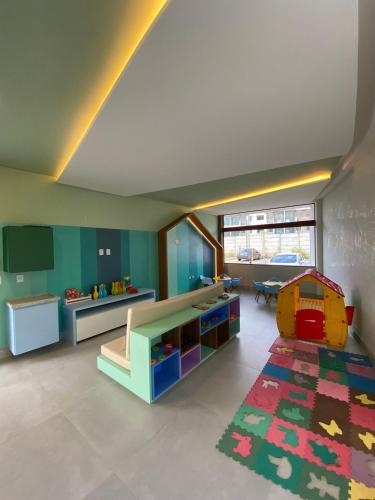 a childrens room with a table and a playroom at Mana Beach Experience Muro Alto C219 in Porto De Galinhas