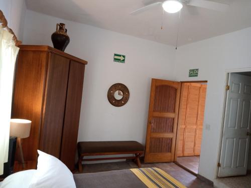 Ένα ή περισσότερα κρεβάτια σε δωμάτιο στο Hacienda De Palmas