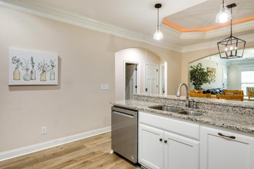 a kitchen with a sink and a mirror at Charming Alabama Retreat with Patio and Pool Access! in Owens Cross Roads