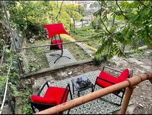 a group of red chairs sitting on a balcony at 6-A Diamond in Yonkers, NY in Yonkers