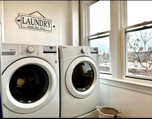 a laundry room with a washing machine and a window at 6-A Diamond in Yonkers, NY in Yonkers