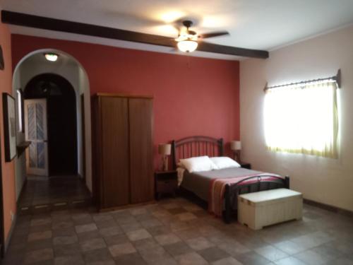 Ένα ή περισσότερα κρεβάτια σε δωμάτιο στο Hacienda De Palmas