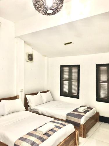 Postel nebo postele na pokoji v ubytování Meet sunset hostel Luangprabang