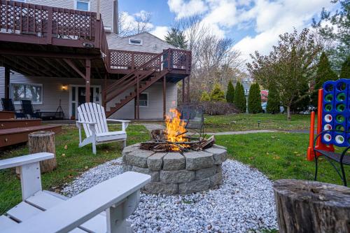 a fire pit in a yard next to a house at H2 1 Bedroom Downtown Stamford in Stamford