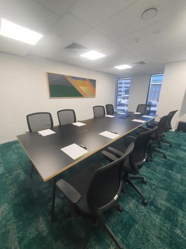 a conference room with a long table and chairs at La Quinta by Wyndham Ellerslie Auckland in Auckland