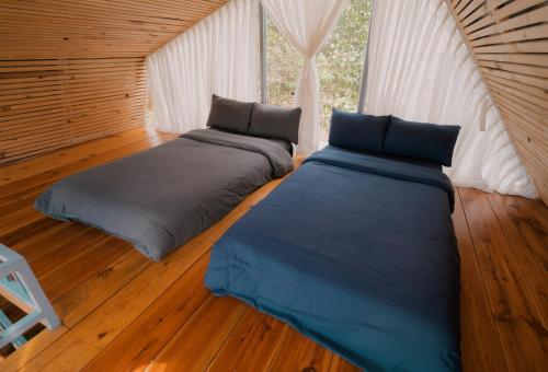Кровать или кровати в номере Mơ Garden Retreat DaLat