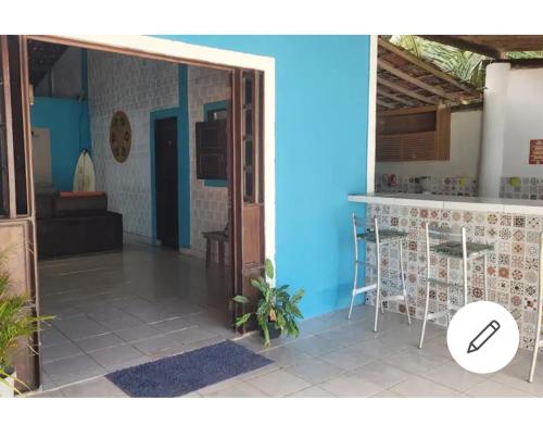 a view of the kitchen and living room of a house at República Francês in Marechal Deodoro