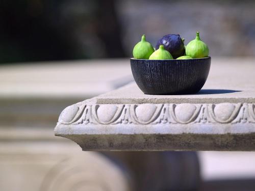 a bowl of fruit sitting on a table at Orpheas Resort Hotel (Adults Only) in Georgioupolis