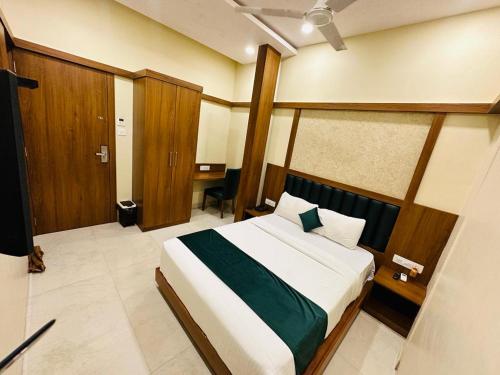 a bedroom with a large bed in a room at HOTEL BKC DOWNTOWN - NEAR US EMBASSY in Mumbai