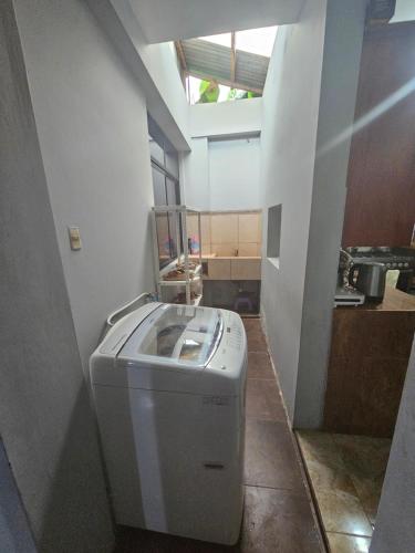 a washer and dryer sitting in a room at Casa Yarinacocha in Pucallpa
