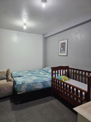 Un pat sau paturi într-o cameră la Casa Yarinacocha