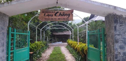 an entrance to a garden with a sign that reads homestead luxury living at Homestay Làng Châng in Ha Giang