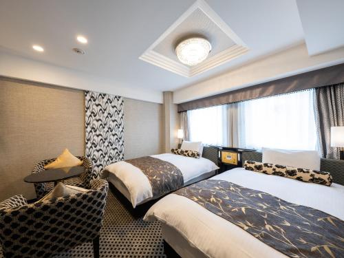Voodi või voodid majutusasutuse APA Hotel Hatchobori Ekimae toas