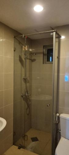 a shower with a glass door in a bathroom at On320 Residencies in Colombo
