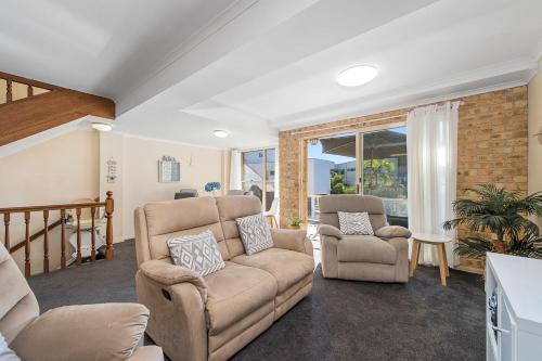 a living room with a couch and two chairs at Ocean Shores 2 South West Rocks - No Sheets or Towels provided in South West Rocks