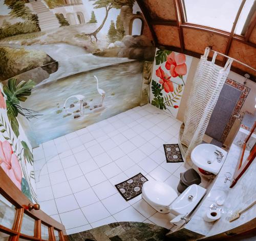 an overhead view of a bathroom with two toilets at Kokosnuss Garden Resort in Coron