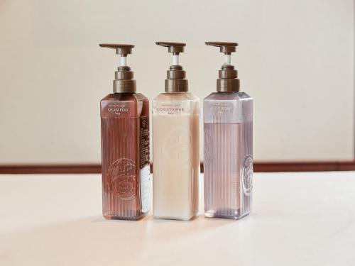 three bottles ofodorizers sitting next to each other at GRG Hotel Naha Higashimachi in Naha