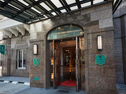 an entrance to a building with a revolving door at GRG Hotel Naha Higashimachi in Naha