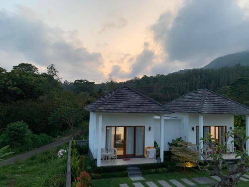 a small house in the middle of a field at Bali Astetic Villa and Hot Spring in Kintamani