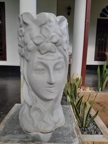 a statue of a bust of a woman at Villa Ali in Galle