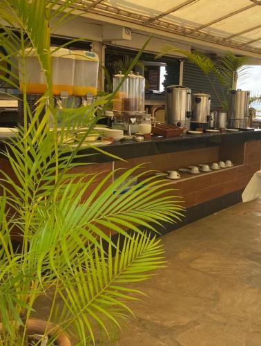 a large kitchen with pots and pans on a counter at Indiana Beach Apartments in Bamburi