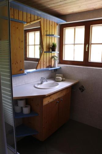 a bathroom with a sink and a mirror at Straniger Alm in Stranig