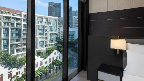 a hotel room with a view of a city at InterContinental Singapore Robertson Quay by IHG in Singapore