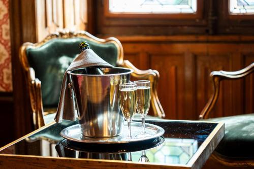 a tray with two glasses of champagne on a table at Le Manoir Saint Thomas in Amboise