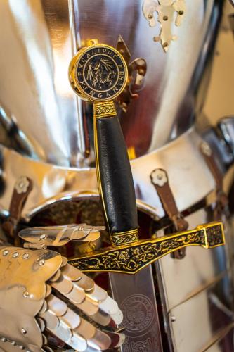 a gold knife with a black handle in front of a mirror at Le Manoir Saint Thomas in Amboise