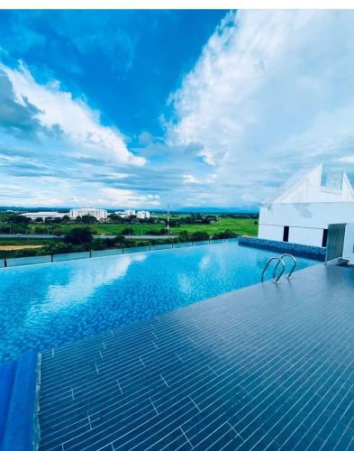 a swimming pool on top of a building at Imperio Professional Studio by AFINI in Alor Setar