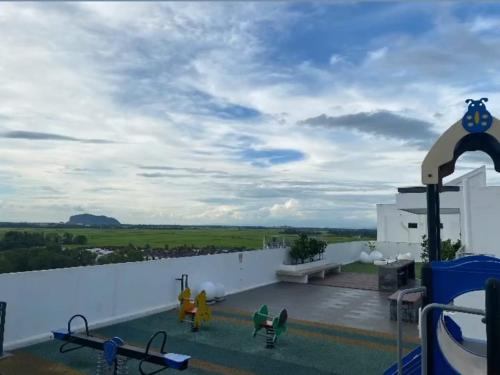 a view from the roof of a house with a swimming pool at Imperio Professional Studio by AFINI in Alor Setar