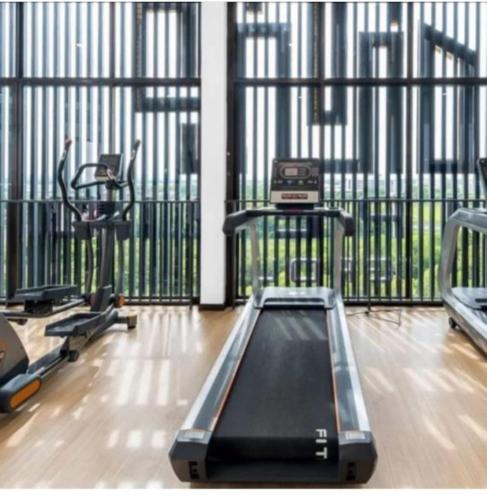a gym with two treadmills and a treadmill at Imperio Professional Studio by AFINI in Alor Setar