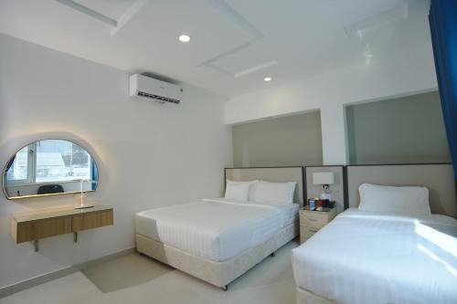 Giường trong phòng chung tại A25 Hotel - 14 Lương Hữu Khánh