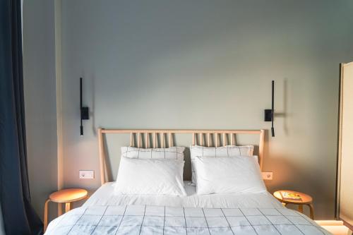 a bedroom with a bed with two white pillows at Ba & Bu Apartment 1 in Katerini