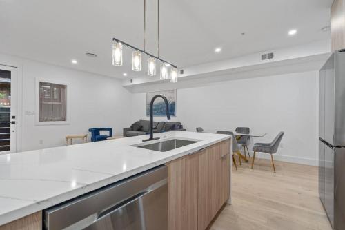 a kitchen with a sink and a counter top at Capitol View1 Charming Oasis in DC near Metro with Fenced Backyard Free Parking and WIFI in Washington, D.C.