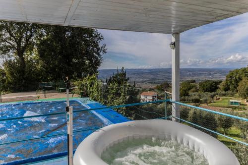 a bath tub on a balcony with a view at Casa vacanze Guardea in Guardea