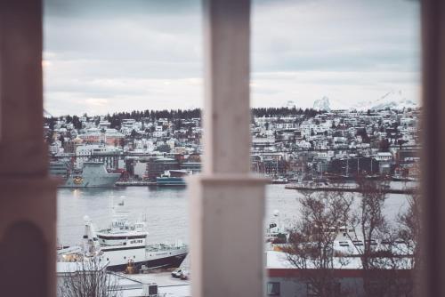 a view of a harbor from a window at Villa Havblikk Tromsø in Tromsø