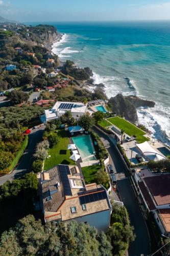 an aerial view of a house and the ocean at Villa VERNEY in Albisola Superiore