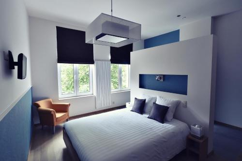 Llit o llits en una habitació de Côté Sax bed and breakfast