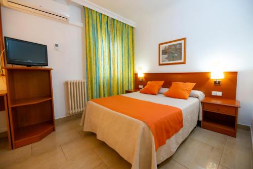 Letto o letti in una camera di Hotel Risech