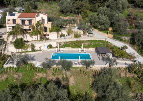 an aerial view of a villa with a swimming pool at Serenity River Villa in Palaiochora