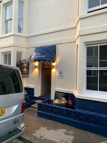 a van parked in front of a building at Cunard Guest House in Weymouth