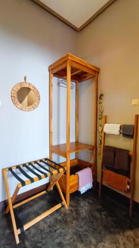 a room with two bunk beds and a mirror at Dalai Tropical in Kuta Lombok