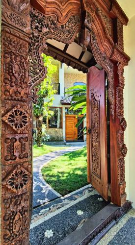an entrance to a house with an open door at Dalai Tropical in Kuta Lombok