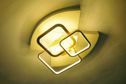 a light on a wall with a holder on it at RB Modern Condos in Zamboanga