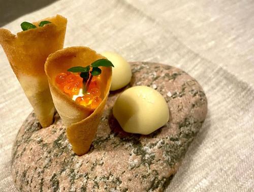 a piece of bread with eggs on top of it at Grand Hôtel Mölle in Mölle