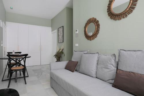 a living room with a couch and a table at Luces de Catedral in Alicante