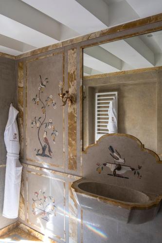 a bathroom with a sink and a mirror at Hotel Nani Mocenigo Palace in Venice