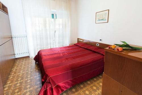 Ένα ή περισσότερα κρεβάτια σε δωμάτιο στο Casavacanze Internazionale