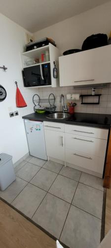 Nhà bếp/bếp nhỏ tại Appartement les 2 Alpes avec vue sur la muzelle